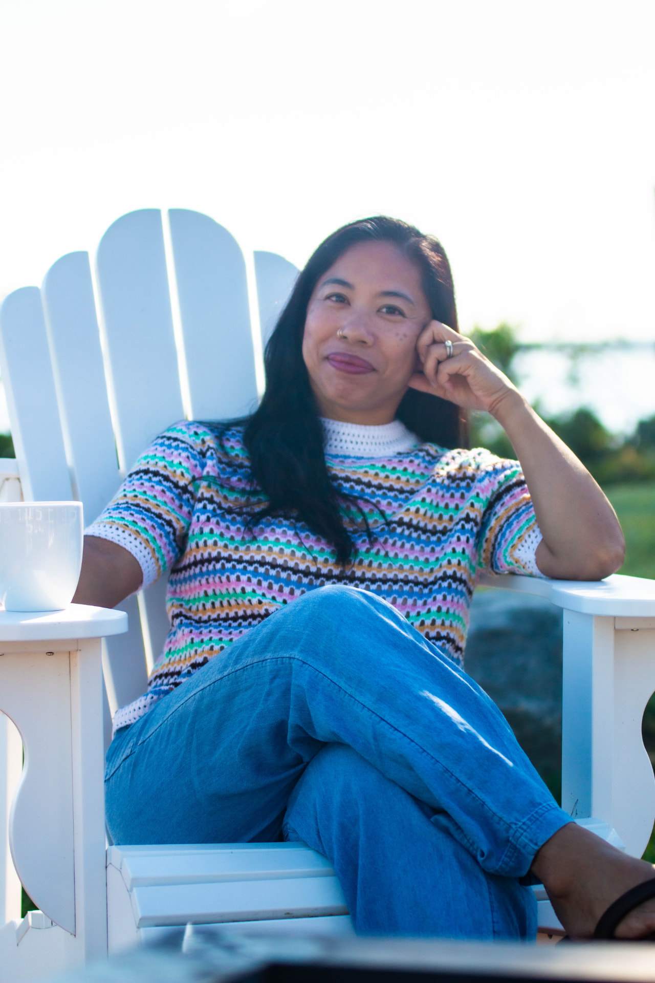 Leilani Attilio seated beside the waterfront